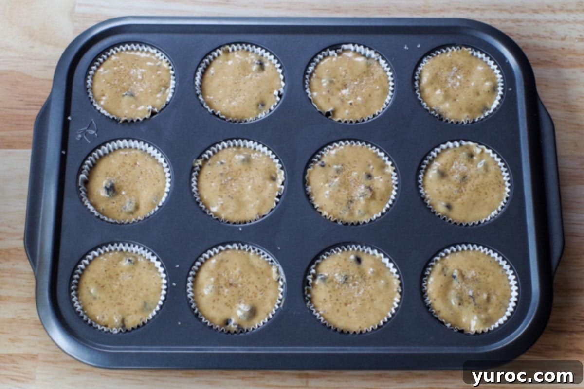 Heavenly Saskatoon Berry Muffins 8 batter in lined muffin pans