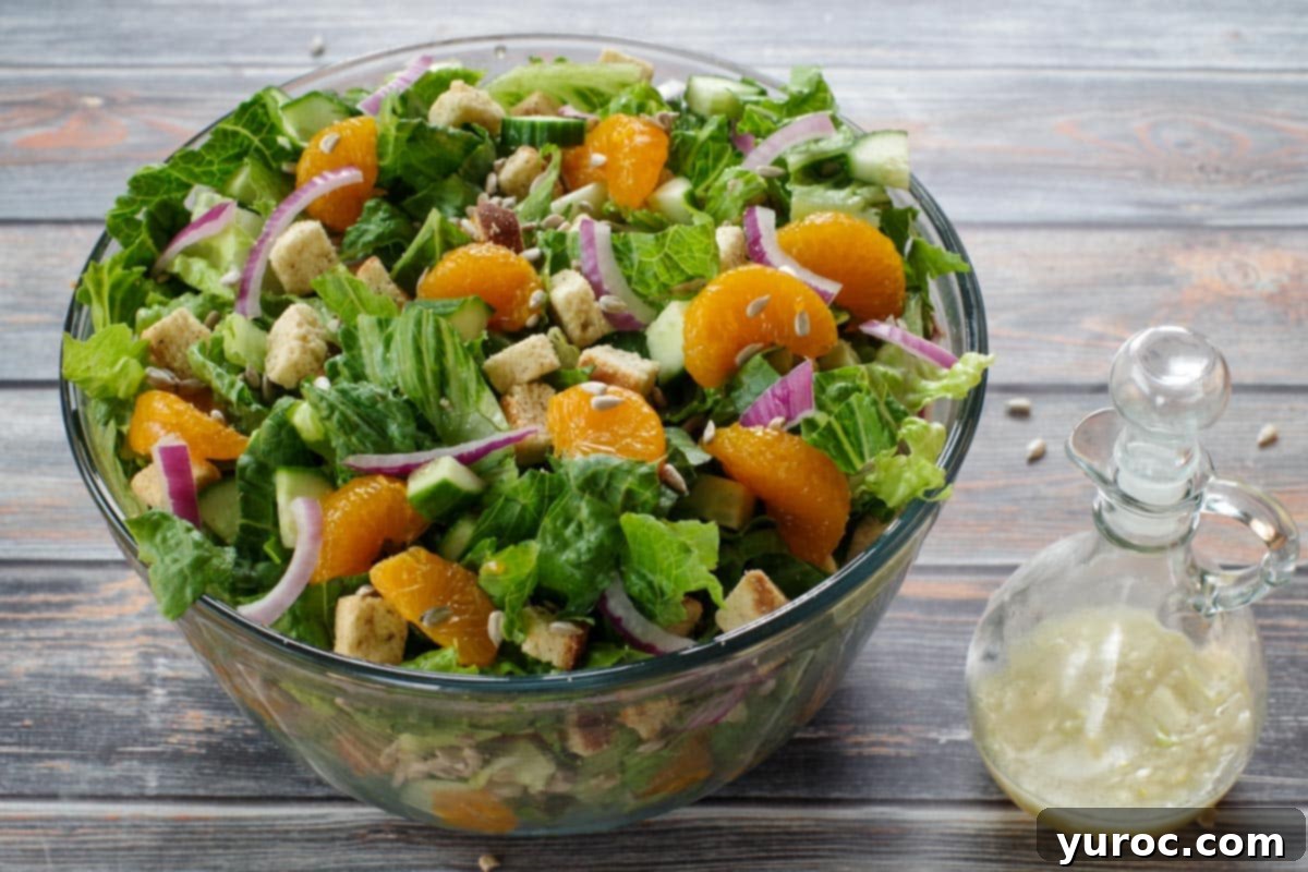Mandarin salad ingredients gently mixed together in a large bowl
