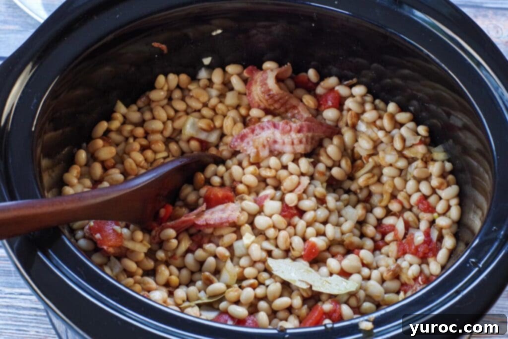 Slow cooker baked beans ingredients mixed together in the crockpot