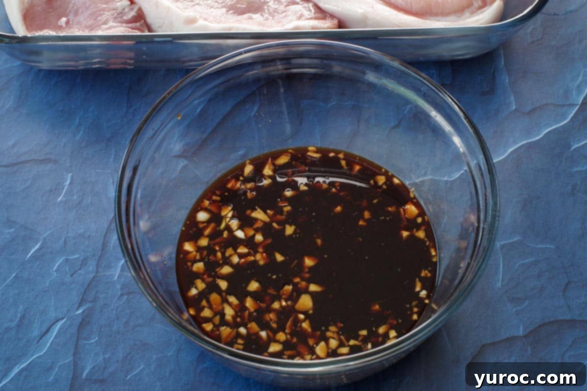 ingredients for soy ginger lemon marinade whisked together in a bowl