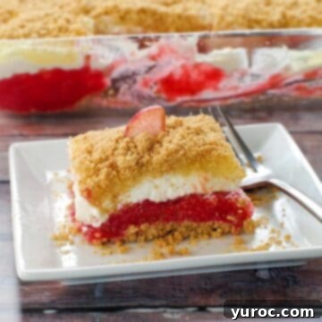 15 Easy No Bake Potluck Desserts 6 Rhubarb dessert on a white plate with fork on the right side and pan of more dessert in the background