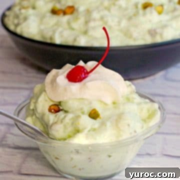 15 Easy No Bake Potluck Desserts 7 pistachio fluff in a glass bowl with a larger bowl in the background
