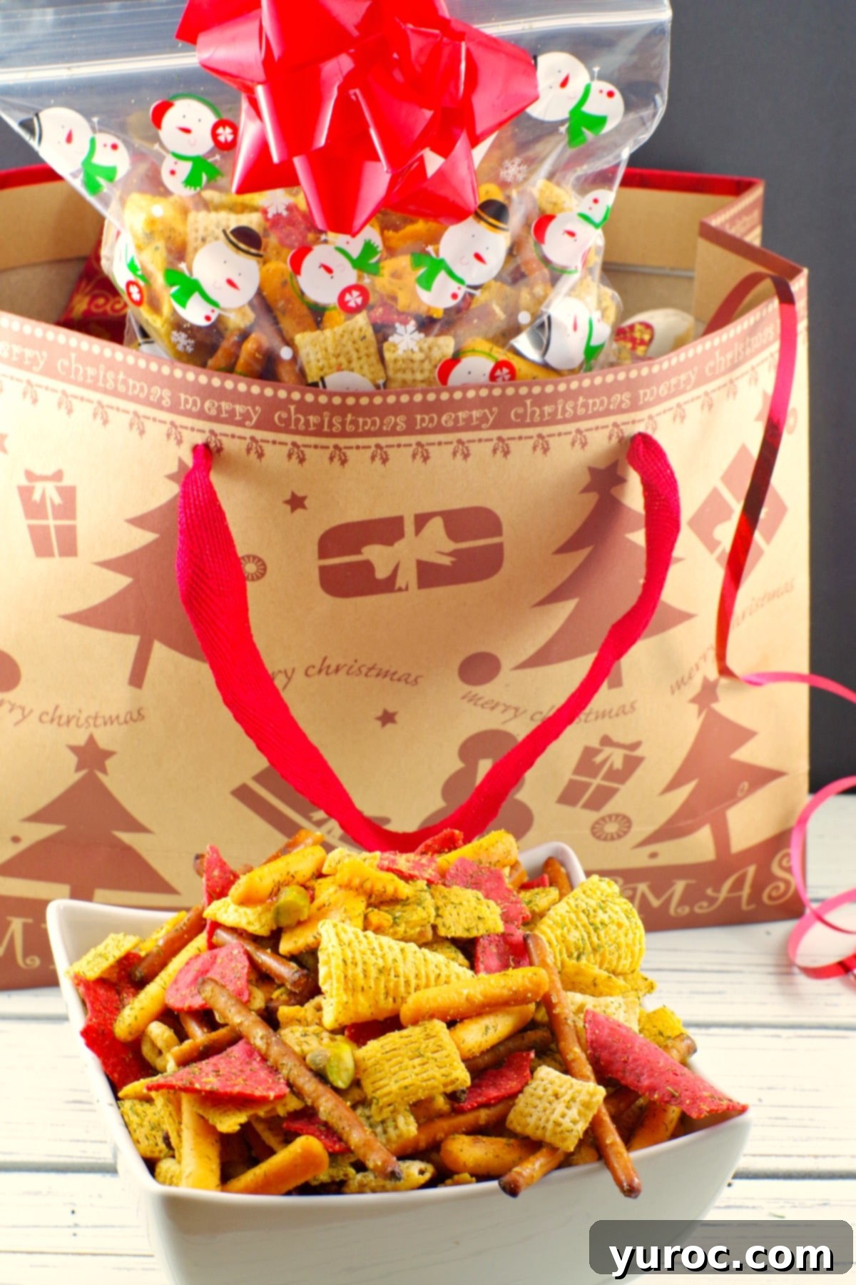 A festive holiday Chex Mix recipe, a savory snack mix perfect for parties, with a holiday background. Keywords: #chexmix #partymix #holiday