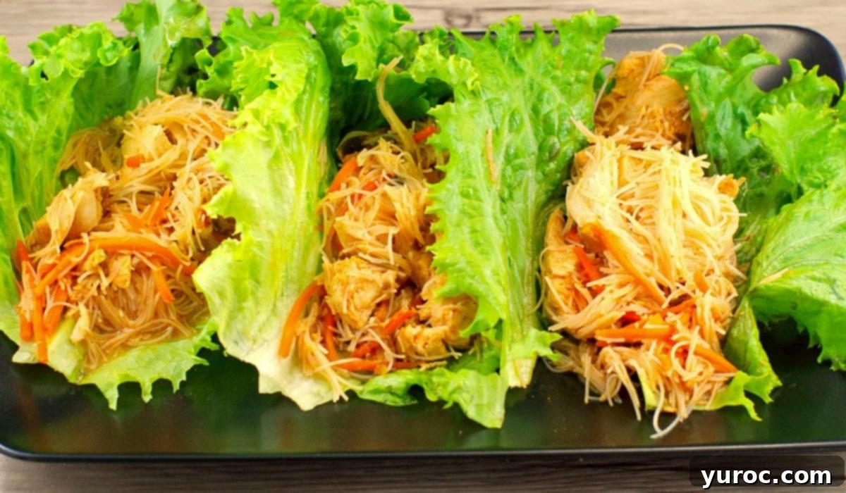 Honey Fire Chicken Lettuce Embrace 13 3 honey sriracha chicken lettuce wraps on a black platter