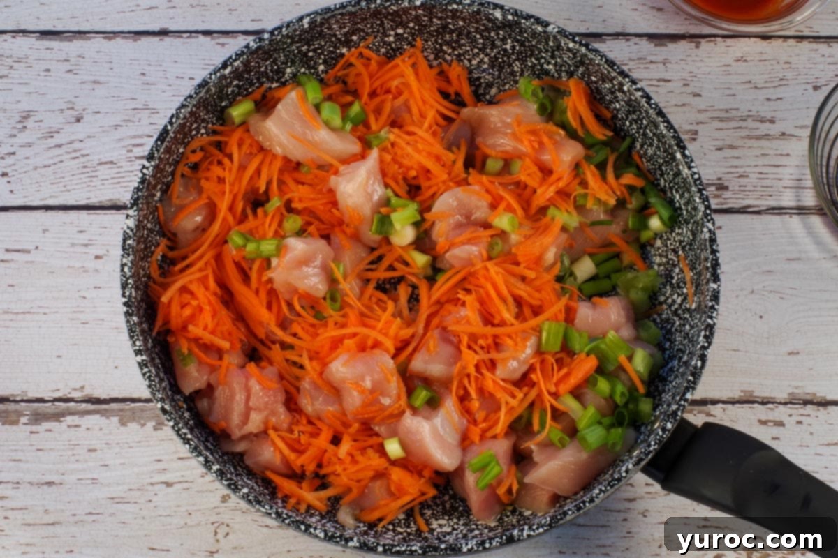 Honey Fire Chicken Lettuce Embrace 4 Chicken, olive oil, carrots and onions added to skillet.