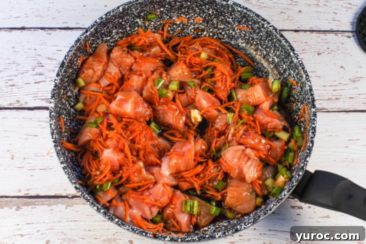 Honey Fire Chicken Lettuce Embrace 6 Sauce added to chicken mixture.