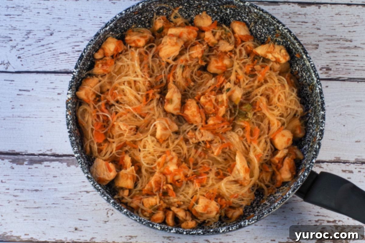 Honey Fire Chicken Lettuce Embrace 9 Noodles added to chicken mixture in skillet.