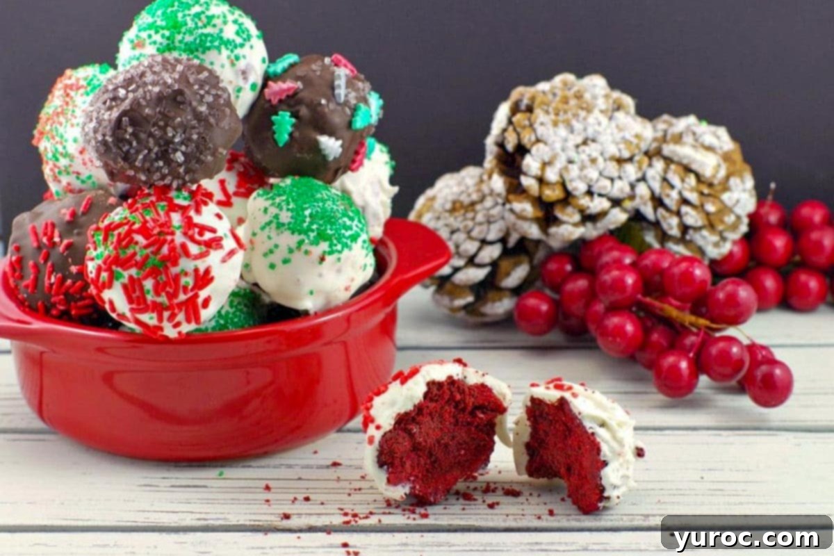 red velvet brownie bite split in half with dish of red velvet brownie bites in the background