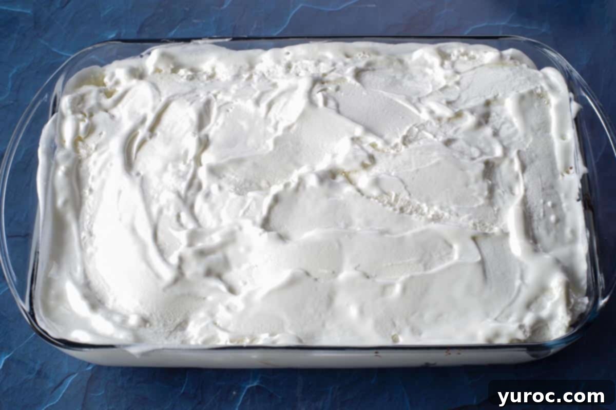 ice cream layer smoothed over fudge