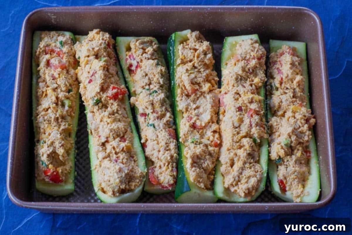 6 buffalo chicken zucchini boats in a 9x13 pan 