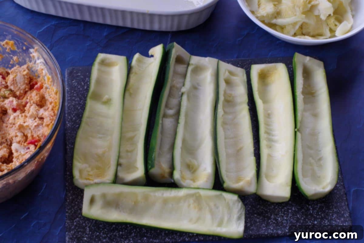 zucchini on cutting board with middle scooped out
