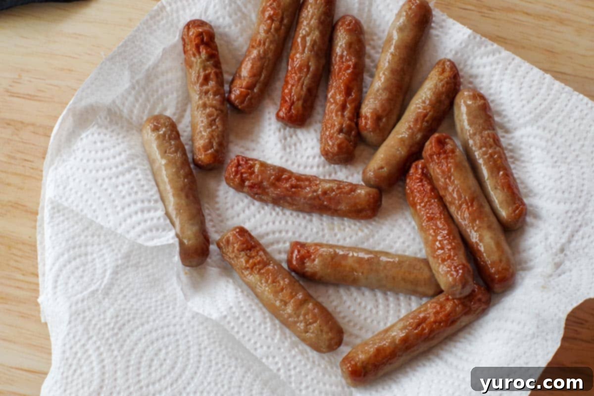 Sausages on plate lined with paper towel