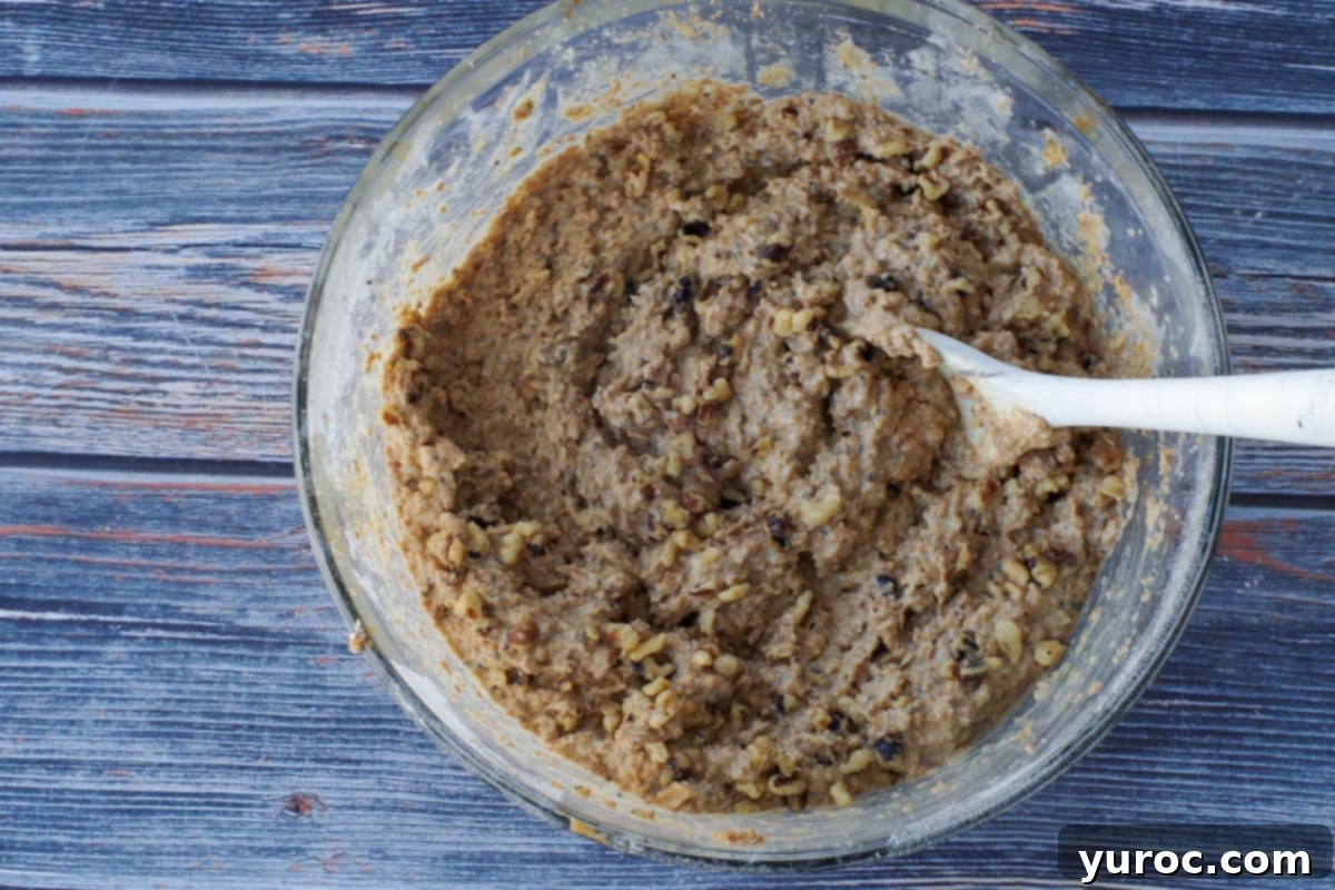 Walnuts stirred into wheat bran muffin batter.