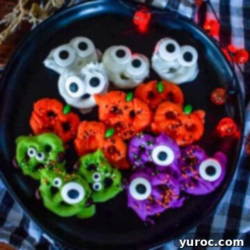 Halloween pretzels on a black plate