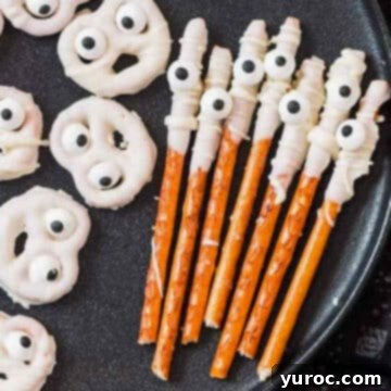ghost and mummy pretzels on black plate