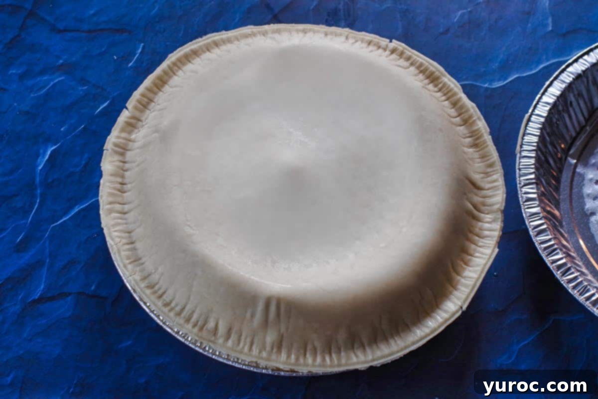 Top pie shell placed on bottom pie shell