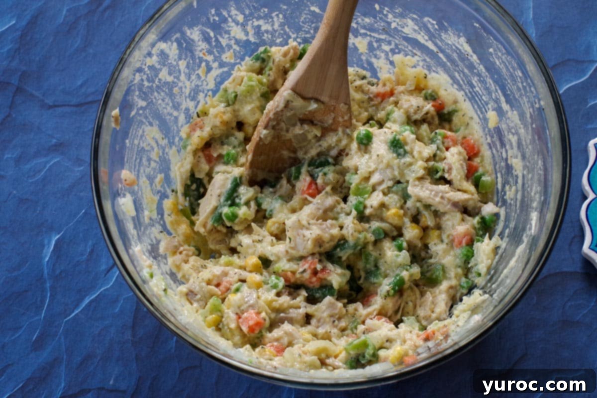All ingredients mixed in large glass bowl.