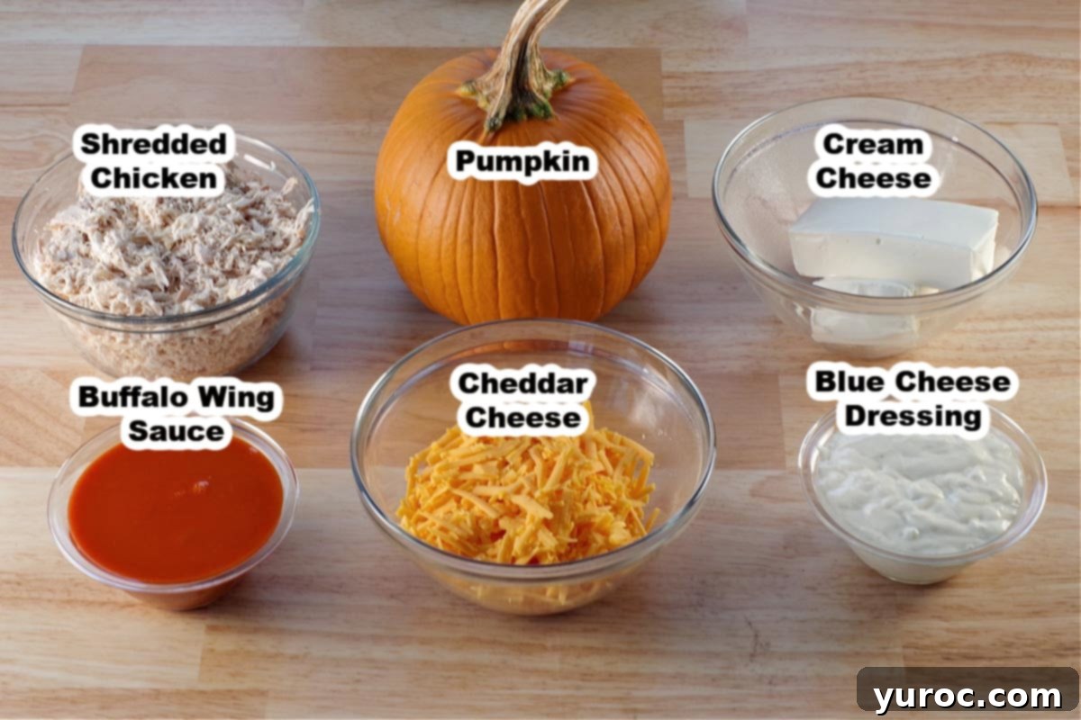 ingredients in Halloween Buffalo chicken dip in glass dishes, labelled