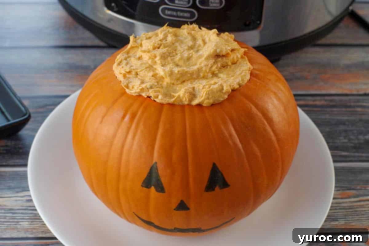 dip covering saran wrap in pumpkin
