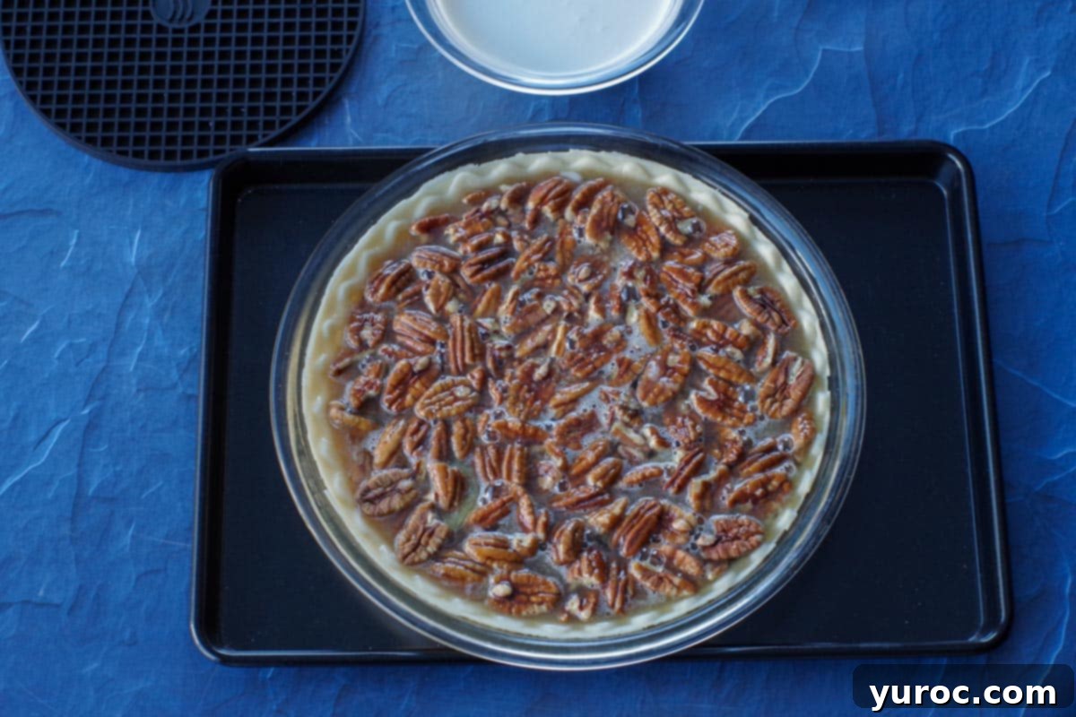 unbaked pecan pie on cookie sheet