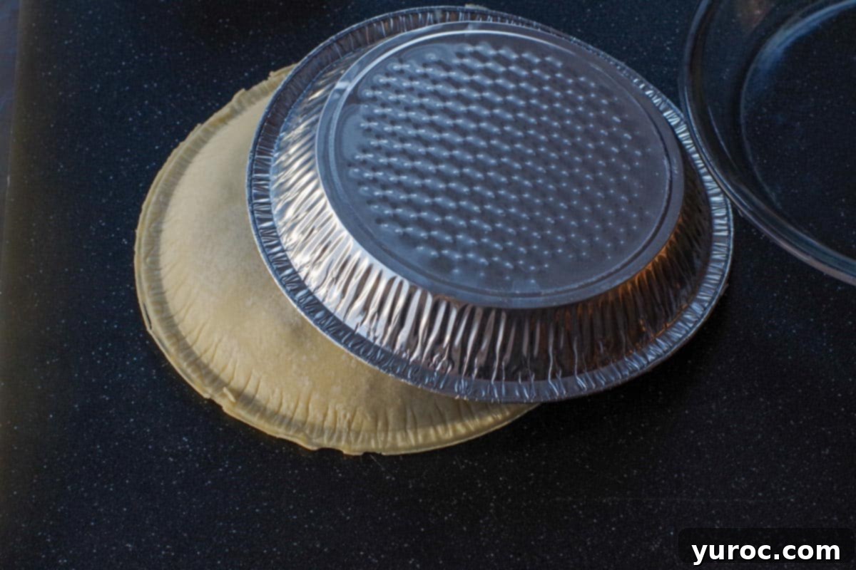 store-bought pie crust flipped off with pie plate removed, but sitting on top