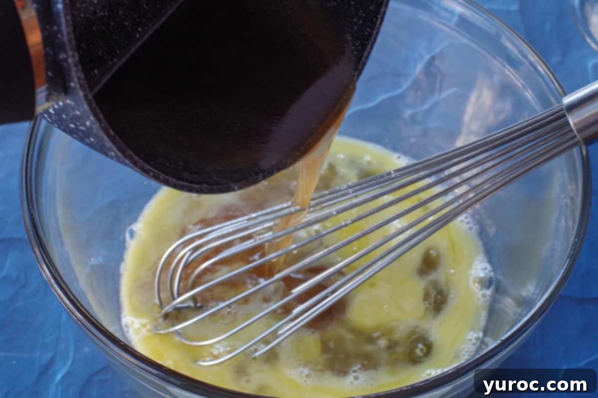 hot syrup being poured into eggs