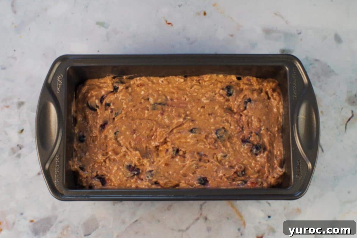 Cozy Blueberry Gingerbread Loaf 9 Batter spread into 9x5 prepared pan.