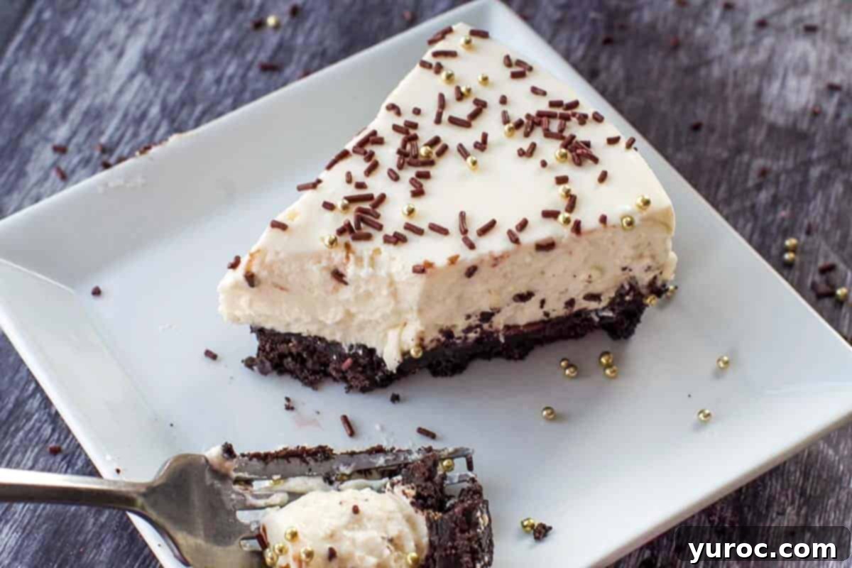 baileys no bake cheesecake being eaten with a fork, on a white plate