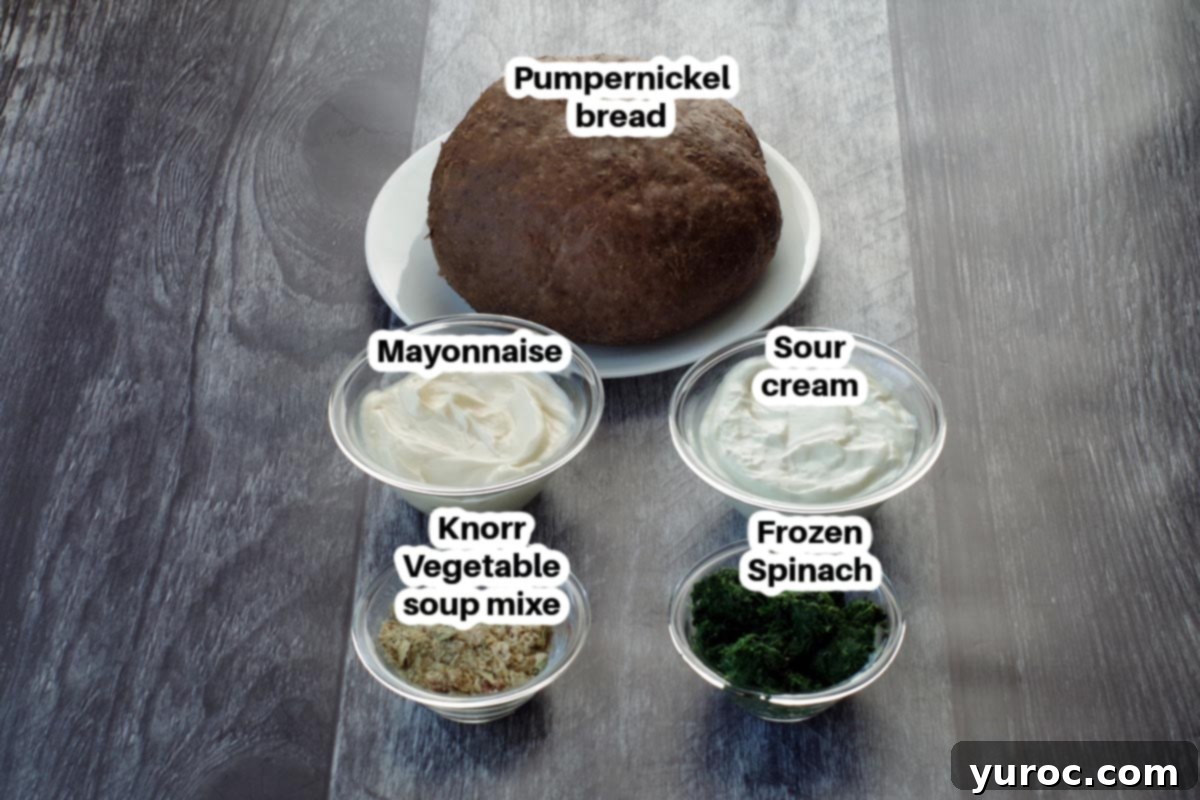 Ultimate Pumpernickel Spinach Dip 2 A selection of ingredients for pumpernickel spinach dip, neatly arranged in glass dishes and labeled.