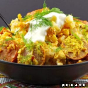 Ukrainian crock pot casserole in a black bowl on a Ukrainian patterned tablecloth