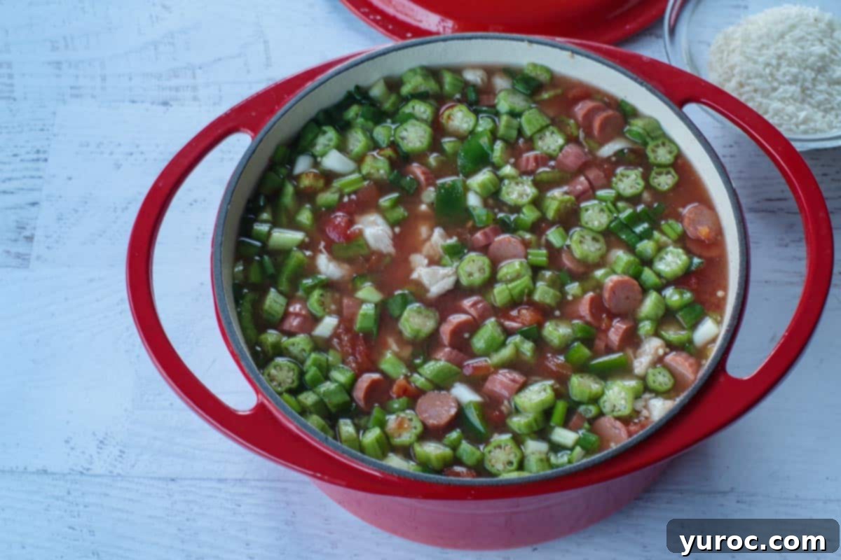 Chicken gumbo soup in a pot, mixed together
