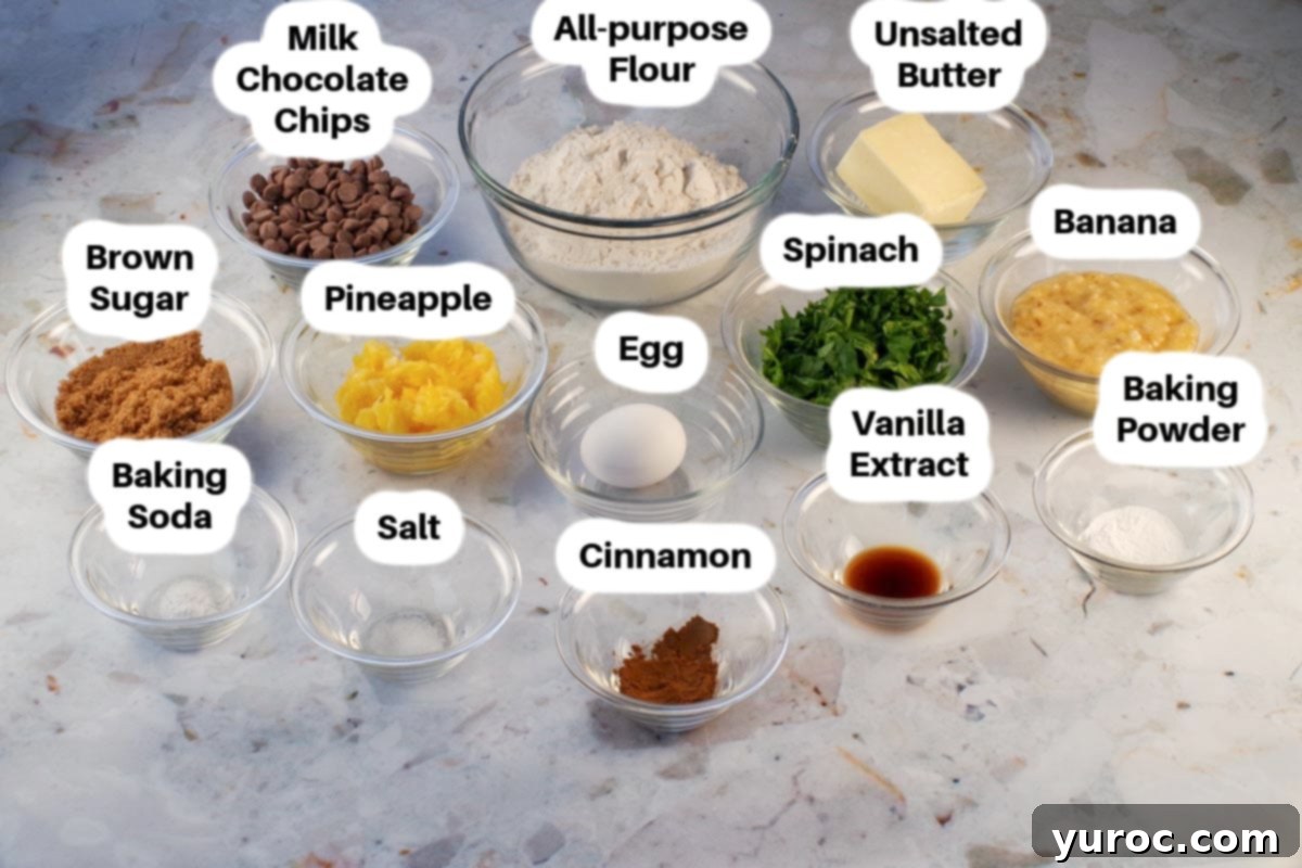 Ingredients in healthy chocolate chip spinach cookies in glass bowls, labelled.