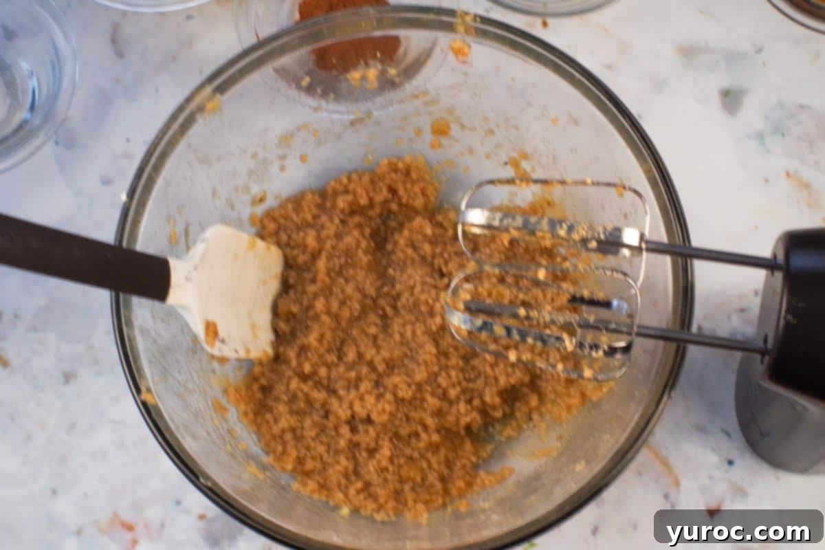 Mashed banana beaten into butter and sugar mixture.