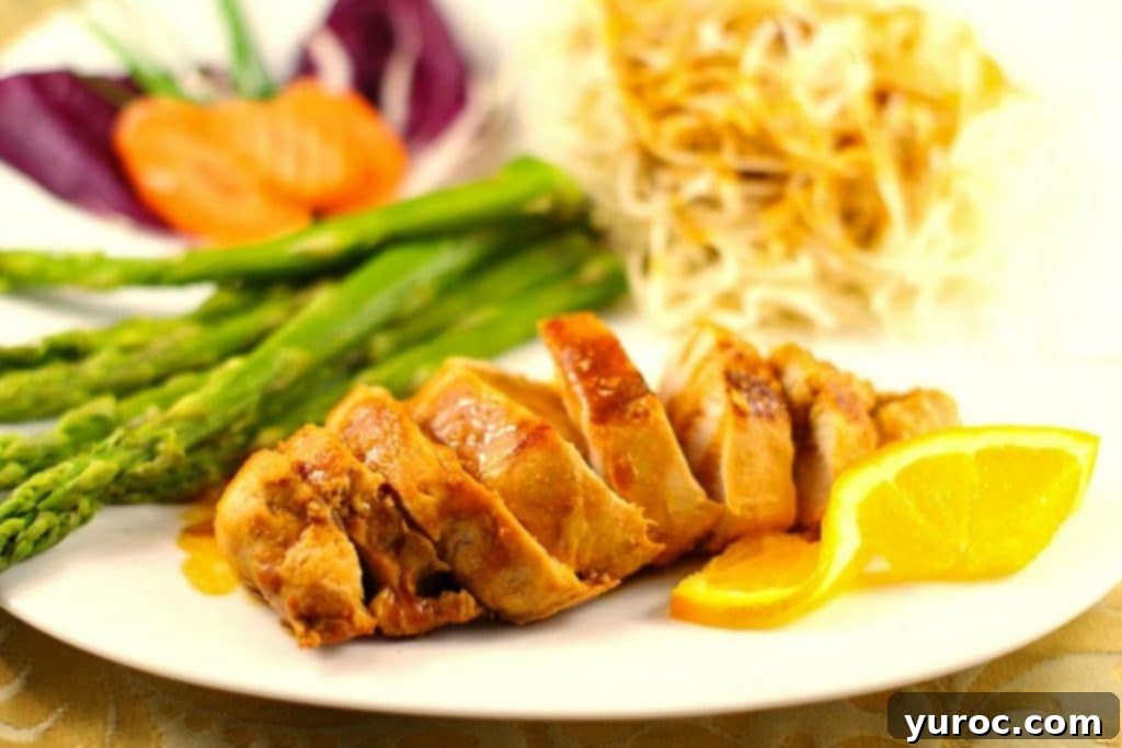 Sticky Orange Hoisin Chicken 14 Plated Hoisin sauce chicken with asparagus and chow mein noodles, garnished with orange slices