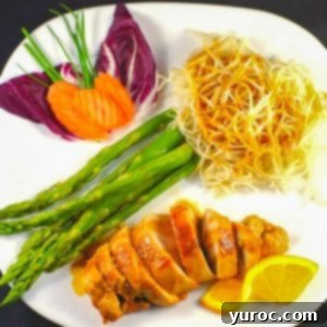 Sticky Orange Hoisin Chicken 15 Plated Hoisin sauce chicken with asparagus and chow mein noodles, garnished with orange slices