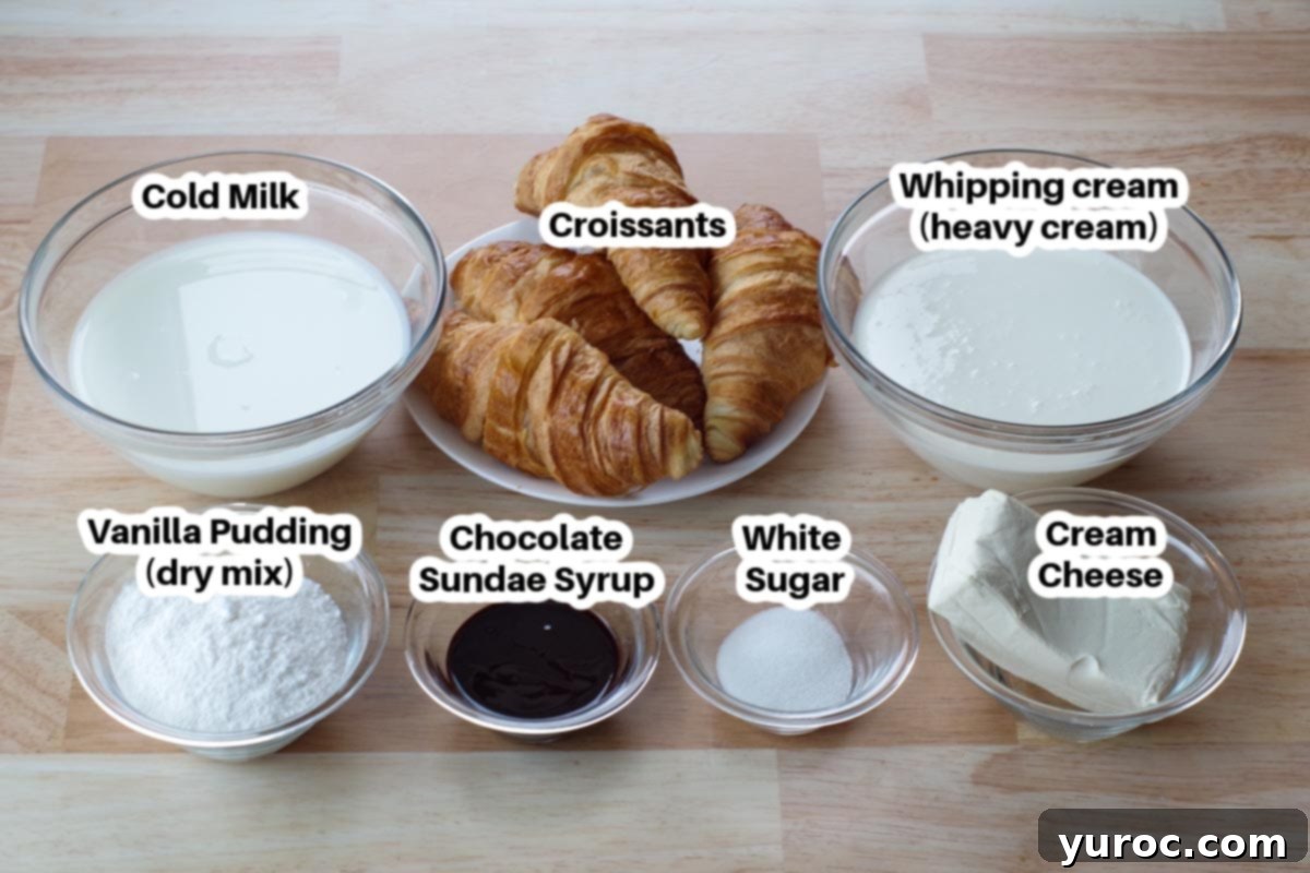 Various ingredients for the no-bake cream puff dessert, including croissants, vanilla pudding mix, cream cheese, and whipping cream, arranged in glass bowls.