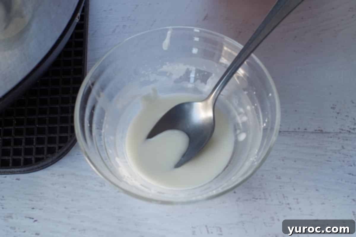 Cornstarch mixed with water in a glass bowl to form a thick paste