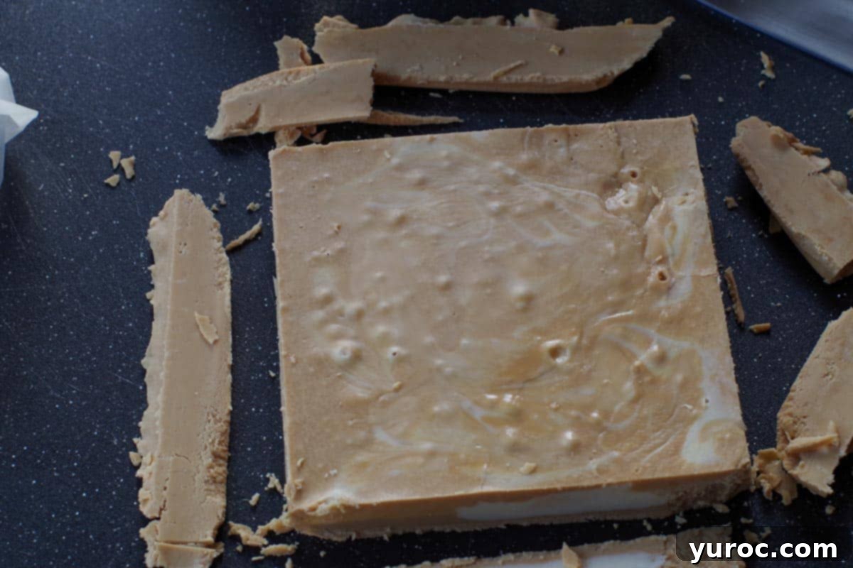 root beer float fudge on back cutting board, with edges cut off