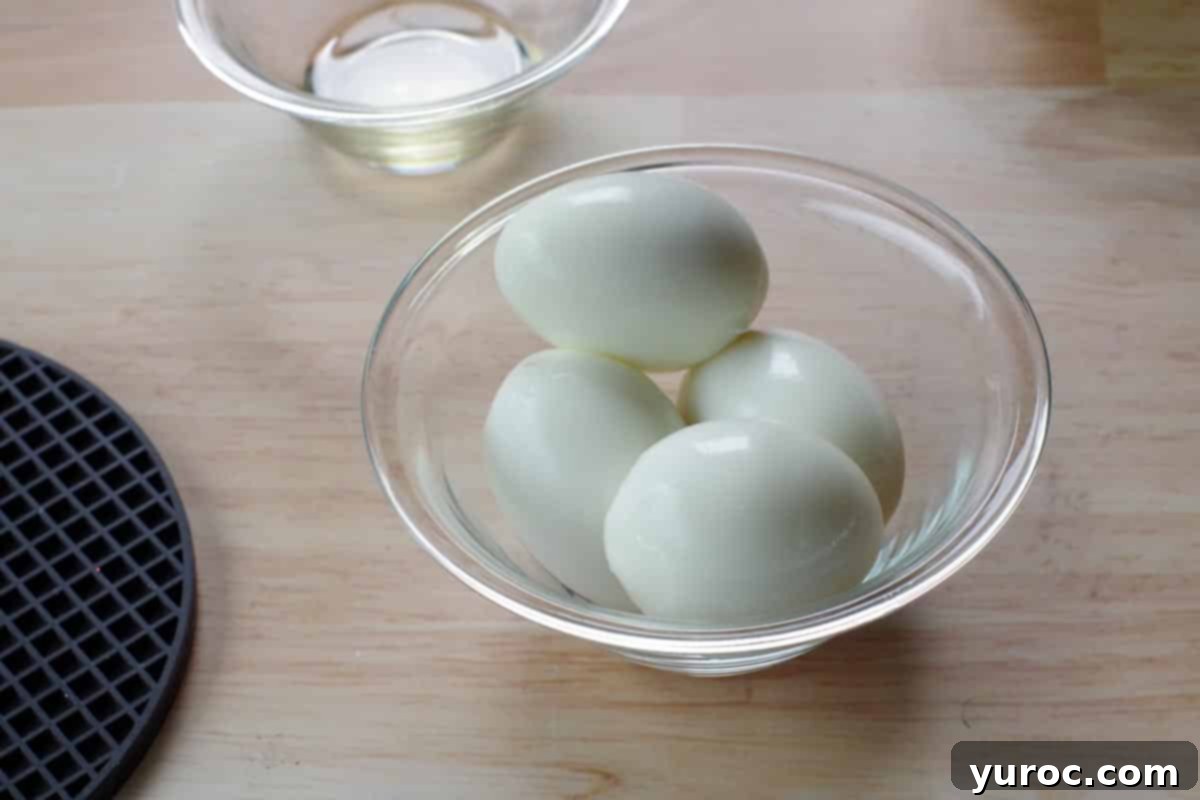 4 hard boiled eggs in a glass bowl