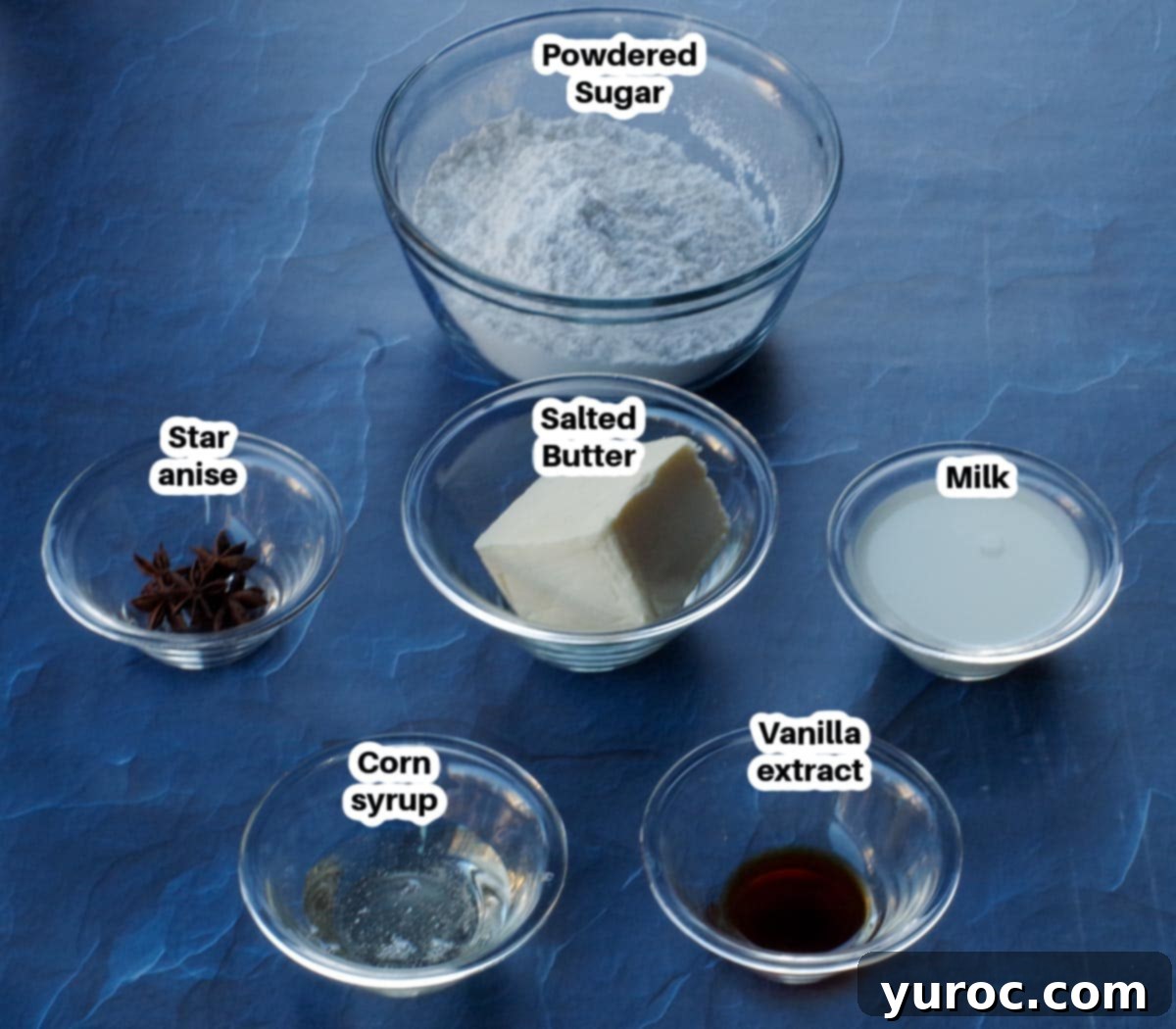 Decadent Salted Soft Butter Toffee 3 Individual glass bowls containing the key ingredients for soft butter toffee, including light corn syrup, salted butter, and powdered sugar, arranged on a rustic surface.