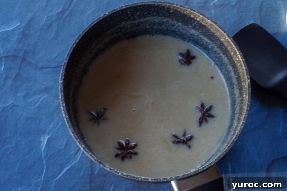 Decadent Salted Soft Butter Toffee 5 The toffee mixture simmering gently in a saucepan for 5 minutes, infusing flavors.