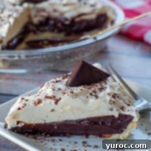 Timeless Chocolate Pie 13 A delicious slice of old fashioned chocolate pie on a white plate, ready to be enjoyed.