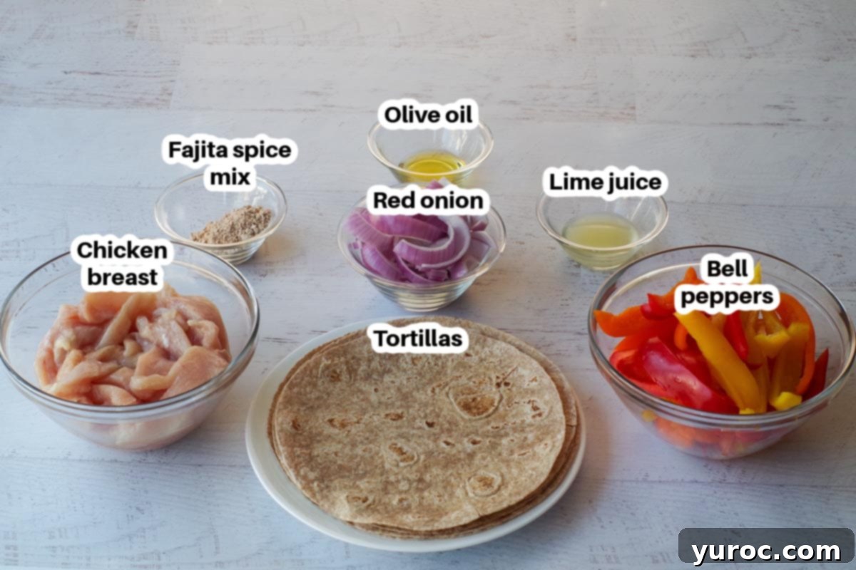 ingredients in air fryer fajitas in glass dishes, labelled