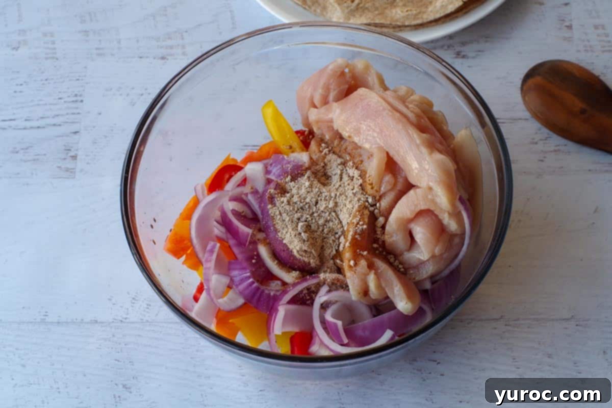 chicken, peppers, onions, fajita spices, oil and lime juice in a bowl