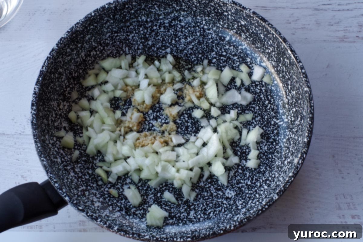 onion and garlic in skillet with olive oil