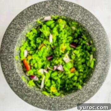What to Serve with Carnitas: 25 Irresistible Recipes 20 Frozen pea guacamole, or Mockamole, served in a grey bowl.