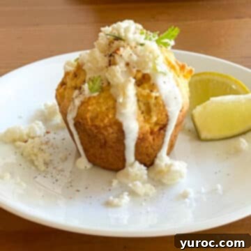 What to Serve with Carnitas: 25 Irresistible Recipes 21 A single Mexican Street Cornbread muffin on a white plate.