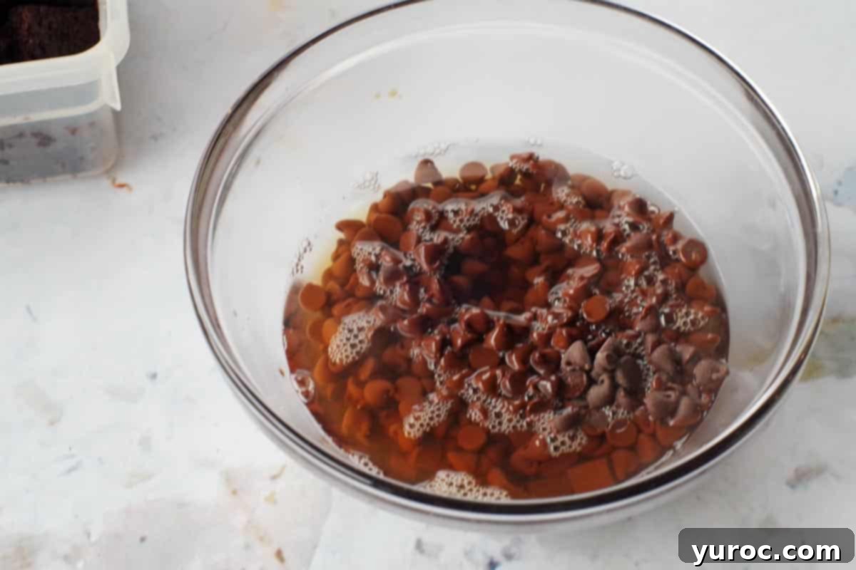 Kahlua-Spiked Death by Chocolate Trifle 6 chocolate chips, Kahlua and boiling water in a glass bowl