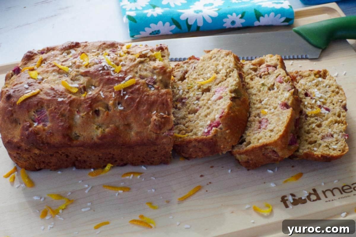 healthy rhubarb bread on a cutting board with 3 pieces sliced