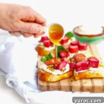 rhubarb on toast with honey being drizzled on it